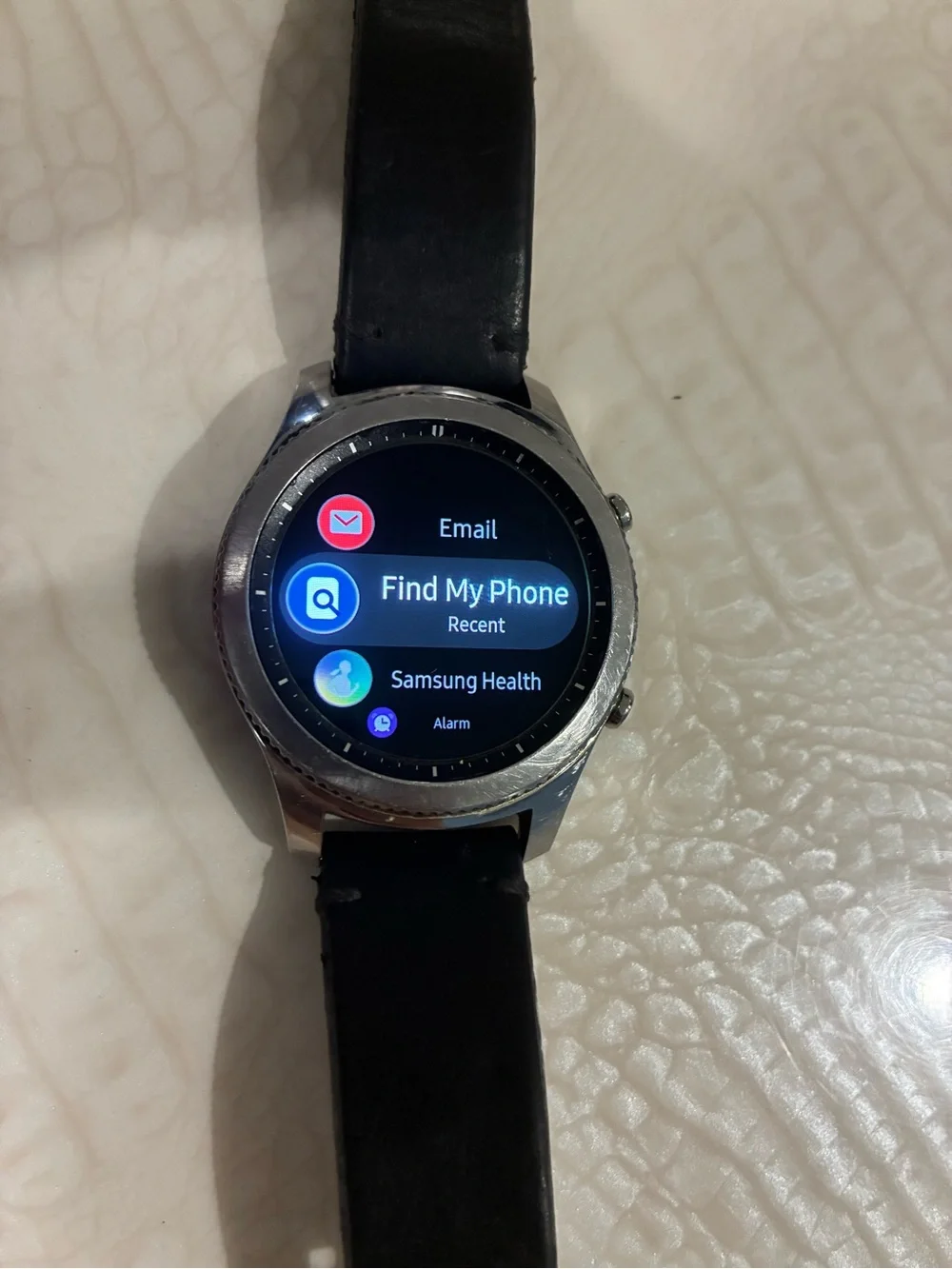Samsung Silver Smartwatch with Black Strap and Blue Display